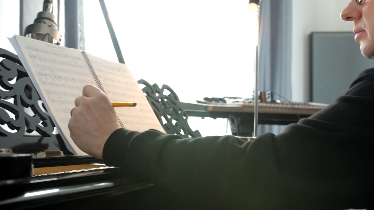 Thomas Berlin composing at his piano